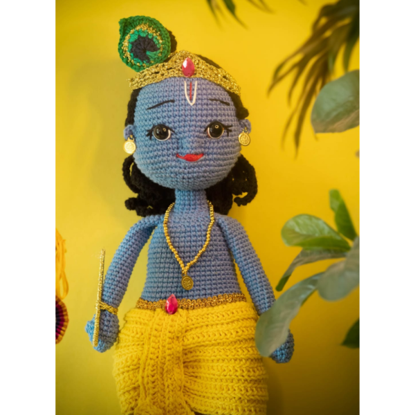 an amigurumi krishna doll