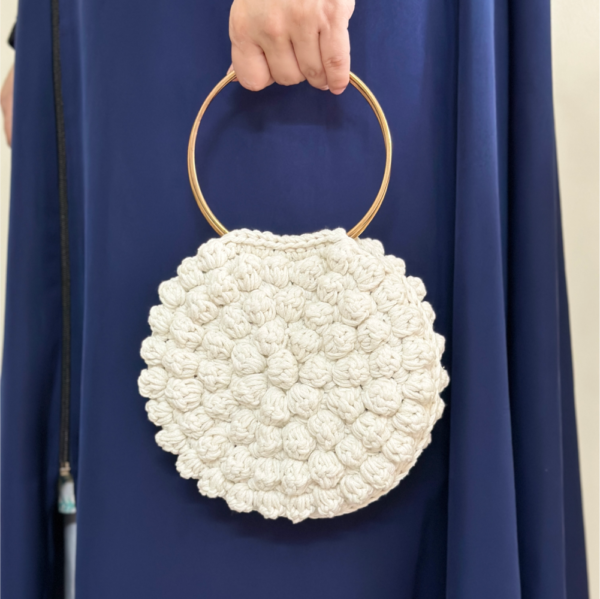 Round white bobble stitch bag