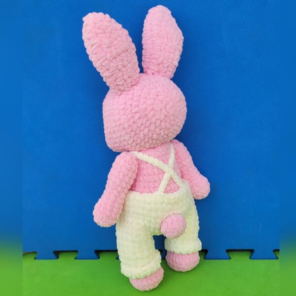 Amigurumi crochet plushie pink bunny with overall back view