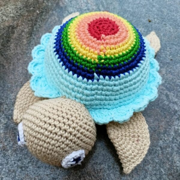 an amigurumi rainbow turtle